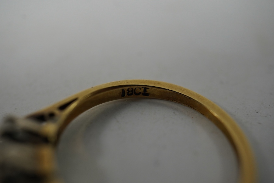 An 18ct gold and three stone diamond set ring, size K, gross weight 2.4 grams. Condition - fair to good